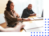 Woman leading meeting at conference table